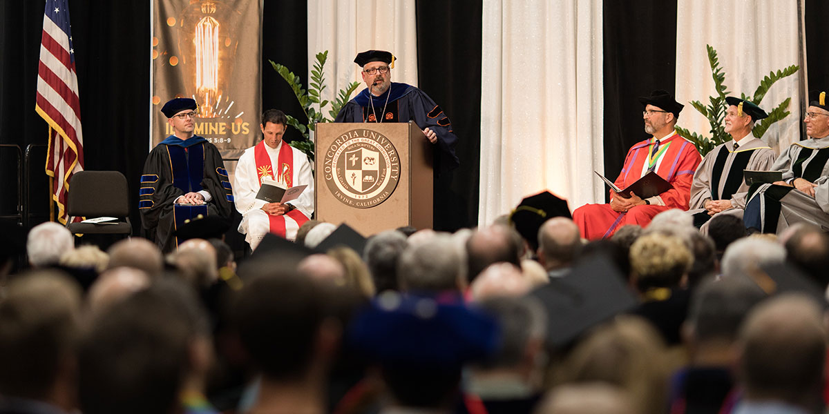 President Thomas at the podium